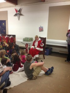 Mrs. Claus reading to the kids.